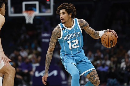 Mar 20, 2023; Charlotte, North Carolina, USA; Charlotte Hornets guard Kelly Oubre Jr. (12) runs the offense against the Indiana Pacers during the second half at Spectrum Center. Mandatory Credit: Nell Redmond-USA TODAY Sports