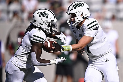 Aug 26, 2023; San Diego, California, USA; Ohio Bobcats quarterback Kurtis Rourke (7) hands off to running back Sieh Bangura (5) during the first half against the San Diego State Aztecs at Snapdragon Stadium. Mandatory Credit: Orlando Ramirez-USA TODAY Sports