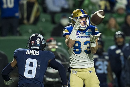 Nov 20, 2022; Regina, Saskatchewan, CAN; Toronto Argonauts defensive back DaShaun Amos (8) looks on as Winnipeg Blue Bombers receiver Dalton Schoen (83) makes a catch during the first half at Mosaic Stadium. Mandatory Credit: Bob Frid-USA TODAY Sports