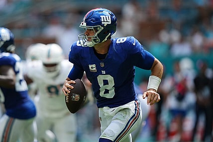 Oct 8, 2023; Miami Gardens, Florida, USA; New York Giants quarterback Daniel Jones (8) scrambles with the ball agianst the Miami Dolphins during the first half at Hard Rock Stadium. Mandatory Credit: Jasen Vinlove-USA TODAY Sports