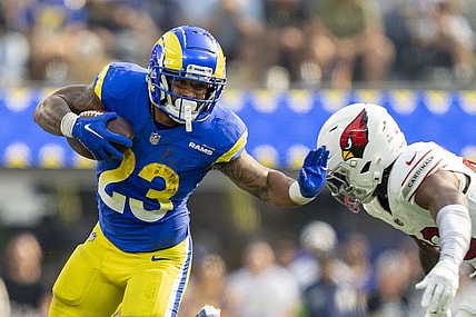 October 15, 2023; Inglewood, California, USA; Los Angeles Rams running back Kyren Williams (23) runs the football against Arizona Cardinals cornerback Marco Wilson (20) during the third quarter at SoFi Stadium. Mandatory Credit: Kyle Terada-USA TODAY Sports