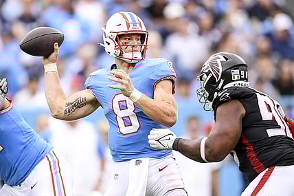 Oct 29, 2023; Nashville, Tennessee, USA; Tennessee Titans quarterback Will Levis (8) throws a pass just before getting hit by Atlanta Falcons defensive tackle David Onyemata (90) during the second half at Nissan Stadium. Mandatory Credit: Steve Roberts-USA TODAY Sports