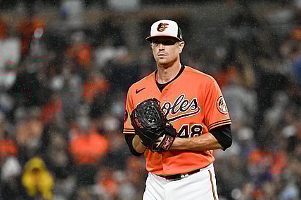 Sep 30, 2023; Baltimore, Maryland, USA;  Baltimore Orioles starting pitcher Kyle Gibson (48) stands on the pitcher's mound as rain falls during the second inning against the Boston Red Sox at Oriole Park at Camden Yards. Mandatory Credit: Tommy Gilligan-USA TODAY Sports
