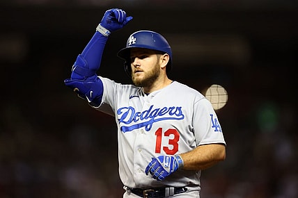 Oct 11, 2023; Phoenix, Arizona, USA; Los Angeles Dodgers third baseman Max Muncy (13) reacts after hitting a single against the Arizona Diamondbacks in the seventh inning for game three of the NLDS for the 2023 MLB playoffs at Chase Field. Mandatory Credit: Mark J. Rebilas-USA TODAY Sports