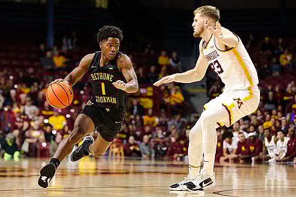 Nov 6, 2023; Minneapolis, Minnesota, USA; Bethune-Cookman Wildcats guard Zion Harmon (1) dribbles around Minnesota Golden Gophers forward Parker Fox (23) during the second half at Williams Arena. Mandatory Credit: Matt Krohn-USA TODAY Sports