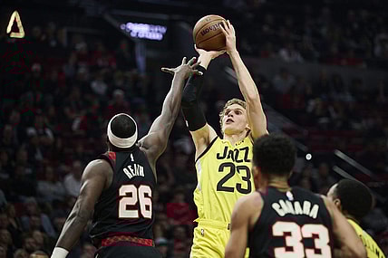 Nov 22, 2023; Portland, Oregon, USA; Utah Jazz forward Lauri Markkanen (23) shoots a jump shot during the first half against Portland Trail Blazers center Duop Reath (26) at Moda Center. Mandatory Credit: Troy Wayrynen-USA TODAY Sports