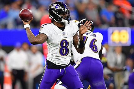 Nov 26, 2023; Inglewood, California, USA; Baltimore Ravens quarterback Lamar Jackson (8) throws against the Los Angeles Chargers during the first half at SoFi Stadium. Mandatory Credit: Gary A. Vasquez-USA TODAY Sports