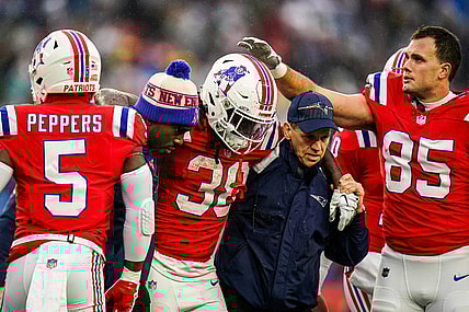 Dec 3, 2023; Foxborough, Massachusetts, USA; New England Patriots running back Rhamondre Stevenson (38) is helped off the field as they take on the Los Angeles Chargers in the second quarter at Gillette Stadium. Mandatory Credit: David Butler II-USA TODAY Sports