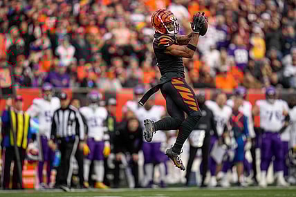 Cincinnati Bengals wide receiver Ja'Marr Chase (1) makes a leaping catch in the fourth quarter of the NFL Week 15 game between the Cincinnati Bengals and the Minnesota Vikings at PayCor Stadium in downtown Cincinnati on Saturday, Dec. 16, 2023. The Bengals won on an overtime field goal.