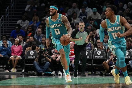 Dec 16, 2023; Charlotte, North Carolina, USA; Charlotte Hornets forward Miles Bridges (0) brings the ball up court against the Philadelphia 76ers during the second half at Spectrum Center. Mandatory Credit: Jim Dedmon-USA TODAY Sports