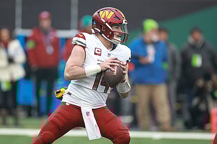 Dec 24, 2023; East Rutherford, New Jersey, USA; Washington Commanders quarterback Sam Howell (14) drops back to pass during the first quarter against the New York Jets at MetLife Stadium. Mandatory Credit: Vincent Carchietta-USA TODAY Sports