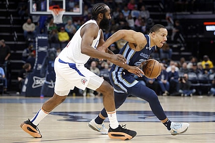 Jan 12, 2024; Memphis, Tennessee, USA; Memphis Grizzlies guard Desmond Bane (22) drives to the basket as Los Angeles Clippers guard James Harden (1) defends during the first half at FedExForum. Mandatory Credit: Petre Thomas-USA TODAY Sports