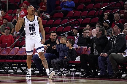 Feb 27, 2024; Fresno, California, USA; Utah State Aggies guard Darius Brown II (10) reacts after making a three point shot against the Fresno State Bulldogs with under two second remaining in the second half at the Save Mart Center. Mandatory Credit: Cary Edmondson-USA TODAY Sports