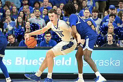 Feb 28, 2024; Omaha, Nebraska, USA; Creighton Bluejays center Ryan Kalkbrenner (11) drives against Seton Hall Pirates center Jaden Bediako (15) in the first half at CHI Health Center Omaha. Mandatory Credit: Steven Branscombe-USA TODAY Sports