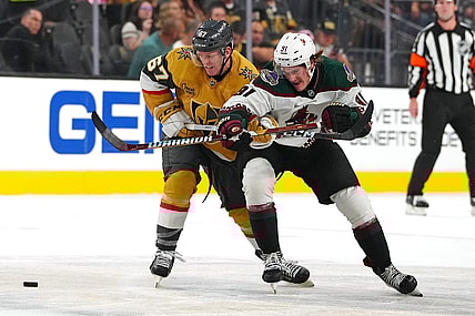 Sep 29, 2023; Las Vegas, Nevada, USA; Vegas Golden Knights left wing Tyler Benson (67) slows Arizona Coyotes right wing Josh Doan (91) during the first period at T-Mobile Arena. Mandatory Credit: Stephen R. Sylvanie-USA TODAY Sports