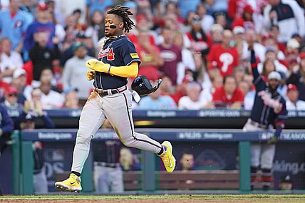 Oct 11, 2023; Philadelphia, Pennsylvania, USA; Atlanta Braves right fielder Ronald Acuna Jr. (13) scores a run on a hit by second baseman Ozzie Albies (not pictured) during the third inning against the Philadelphia Phillies in game three of the NLDS for the 2023 MLB playoffs at Citizens Bank Park. Mandatory Credit: Bill Streicher-USA TODAY Sports