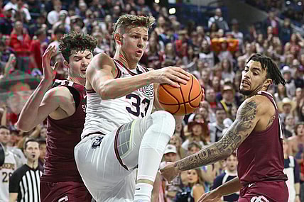 Feb 24, 2024; Spokane, Washington, USA; Gonzaga Bulldogs forward Ben Gregg (33) rebounds the ball against Santa Clara Broncos forward Johnny O'Neil (14) in the second half at McCarthey Athletic Center. Gonzaga Bulldogs won 94-81. Mandatory Credit: James Snook-USA TODAY Sports