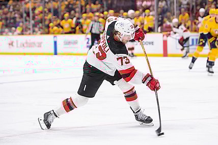 Feb 13, 2024; Nashville, Tennessee, USA;  New Jersey Devils right wing Tyler Toffoli (73) takes a shot on goal against the Nashville Predators during the second period at Bridgestone Arena. Mandatory Credit: Steve Roberts-USA TODAY Sports