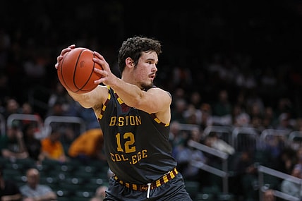 Mar 6, 2024; Coral Gables, Florida, USA; Boston College Eagles forward Quinten Post (12) controls the basketball against the Miami Hurricanes during the second half at Watsco Center. Mandatory Credit: Sam Navarro-USA TODAY Sports