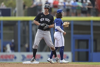 Mar 8, 2024; Dunedin, Florida, USA;  New York Yankees third baseman DJ LeMahieu (26) hits an rbi double against the Toronto Blue Jays in the third inning at TD Ballpark. Mandatory Credit: Nathan Ray Seebeck-USA TODAY Sports