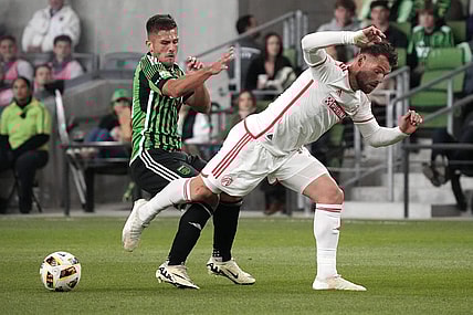 Mar 9, 2024; Austin, Texas, USA; Austin FC forward Diego Rubio (14) and St. Louis CITY SC midfielder Eduard Loewen (10) battle for the ball during the first half at Q2 Stadium. Mandatory Credit: Scott Wachter-USA TODAY Sports