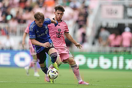 Mar 10, 2024; Fort Lauderdale, Florida, USA; CF Montreal midfielder Bryce Duke (10) dribbles away from Inter Miami CF defender Noah Allen (32) during the first half at Chase Stadium. Mandatory Credit: Nathan Ray Seebeck-USA TODAY Sports