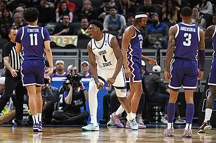 Mar 22, 2024; Indianapolis, IN, USA; Utah State Aggies forward Great Osobor (1) reacts after a play during the first half against the TCU Horned Frogs in the first round of the 2024 NCAA Tournament at Gainbridge FieldHouse. Mandatory Credit: Robert Goddin-USA TODAY Sports