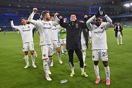 Mar 23, 2024; Kansas City, Kansas, USA; Members of the LA Galaxy celebrate after defeating Sporting Kansas City at Children's Mercy Park. Mandatory Credit: Peter Aiken-USA TODAY Sports