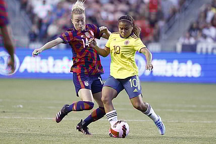Jun 28, 2022; Sandy, Utah, USA; USA defender Emily Sonett (14) and Columbia midfielder Leicy Santos (10) battle in the first half during an international friendly soccer match at Rio Tinto Stadium. Mandatory Credit: Jeffrey Swinger-USA TODAY Sports