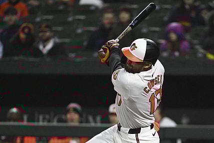 Apr 2, 2024; Baltimore, Maryland, USA; Baltimore Orioles outfielder Colton Cowser swings through a third inning rbi double against the Kansas City Royals  at Oriole Park at Camden Yards. Mandatory Credit: Tommy Gilligan-USA TODAY Sports