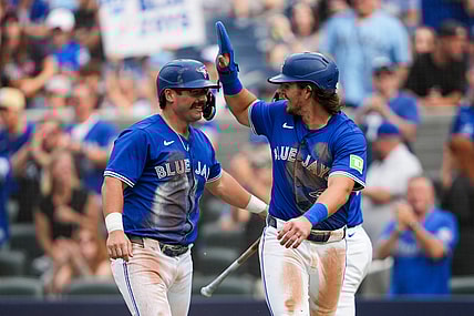 MLB: Davis Schneider & Addison Barger, Toronto Blue Jays, celebrate