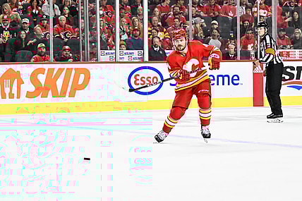 CALGARY, AB - OCTOBER 18: Calgary Flames Defenceman Rasmus Andersson (4) passes the puck during the second period of an NHL game between the Calgary Flames and the Vegas Golden Knights on October 18, 2022, at the Scotiabank Saddledome in Calgary, AB. (Photo by Brett Holmes/Icon Sportswire)