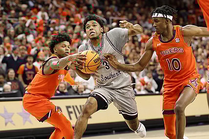 Nov 18, 2022; Auburn, Alabama, USA;  Auburn Tigers guards Wendell Green Jr. (1) and Chance Westry (10) strip the ball from Texas Southern Tigers guard PJ Henry (3) during the first half at Neville Arena. Mandatory Credit: John Reed-USA TODAY Sports