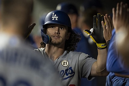 Sep 15, 2023; Seattle, Washington, USA; Los Angeles Dodgers centerfielder James Outman (33) is congratulated by teammates in the dugout after hitting a solo home run during the ninth inning against the Seattle Mariners at T-Mobile Park. Mandatory Credit: Stephen Brashear-USA TODAY Sports