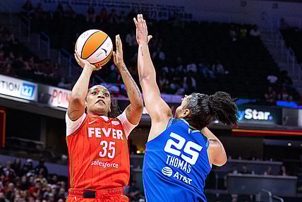 May 19, 2023; Indianapolis, Indiana, USA; Indiana Fever guard Victoria Vivians (35) shoots the ball while Connecticut Sun forward Alyssa Thomas (25) defends in the second half at Gainbridge Fieldhouse. Mandatory Credit: Trevor Ruszkowski-USA TODAY Sports