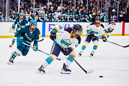 New York Sirens defender Lauren Bernard handles the puck against the Seattle Torrent.