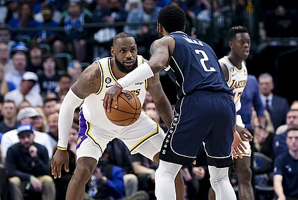 Feb 26, 2023; Dallas, Texas, USA; Los Angeles Lakers forward LeBron James (6) guards Dallas Mavericks guard Kyrie Irving (2) during the fourth quarter at American Airlines Center. Mandatory Credit: Kevin Jairaj-USA TODAY Sports