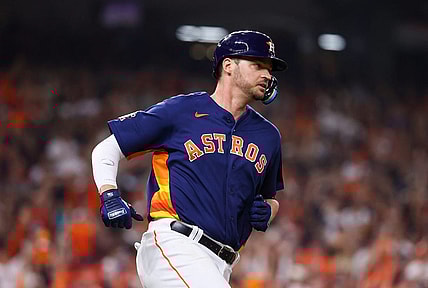 Nov 5, 2022; Houston, Texas, USA; Houston Astros first baseman Trey Mancini (26) runs to first after hitting a single against the Philadelphia Phillies during the third inning in game six of the 2022 World Series at Minute Maid Park. Mandatory Credit: Troy Taormina-USA TODAY Sports