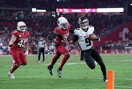 Nov 12, 2023; Glendale, Arizona, USA; Atlanta Falcons quarterback Desmond Ridder (9) runs for a touchdown against the Arizona Cardinals during the second half at State Farm Stadium. Mandatory Credit: Joe Camporeale-USA TODAY Sports