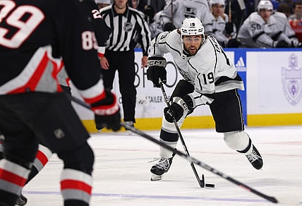 Dec 13, 2022; Buffalo, New York, USA;  Los Angeles Kings left wing Alex Iafallo (19) skates up ice with the puck during the third period against the Buffalo Sabres at KeyBank Center. Mandatory Credit: Timothy T. Ludwig-USA TODAY Sports