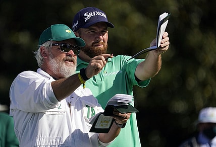 Nov 12, 2020; Augusta, Georgia, USA; Shane Lowry looks down the tenth fairway with his caddie Brian Martin during the first round of The Masters golf tournament at Augusta National GC. Mandatory Credit: Rob Schumacher-USA TODAY Sports