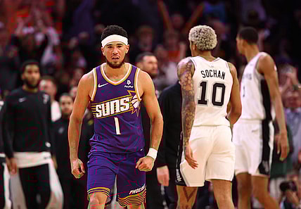 Nov 2, 2023; Phoenix, Arizona, USA; Phoenix Suns guard Devin Booker (1) celebrates a shot against the San Antonio Spurs in the second half at Footprint Center. Mandatory Credit: Mark J. Rebilas-USA TODAY Sports
