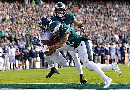 Dec 4, 2022; Philadelphia, Pennsylvania, USA;  Tennessee Titans wide receiver Treylon Burks (16) is hit by Philadelphia Eagles safety Marcus Epps (22) as he makes a touchdown catch during the first quarter at Lincoln Financial Field. Mandatory Credit: Bill Streicher-USA TODAY Sports