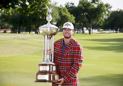 May 29, 2022; Fort Worth, Texas, USA; Sam Burns holds the winners trophy after winning the Charles Schwab Challenge golf tournament in a playoff over Scottie Scheffler. Mandatory Credit: Raymond Carlin III-USA TODAY Sports