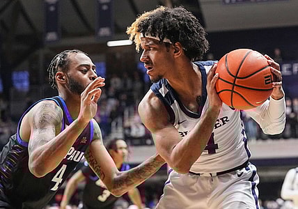 Butler Bulldogs guard DJ Davis (4) holds the ball from DePaul Blue Demons guard K.T. Raimey (4) on Saturday, Jan. 20, 2024, during the game at Hinkle Fieldhouse in Indianapolis. The Butler Bulldogs defeated the DePaul Blue Demons, 74-60.