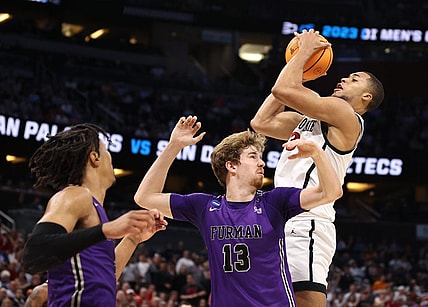 Mar 18, 2023; Orlando, FL, USA;  San Diego State Aztecs forward Jaedon LeDee (13) pulls down a rebound against Furman Paladins forward Garrett Hien (13) during the first half in the second round of the 2023 NCAA Tournament at Legacy Arena. Mandatory Credit: Matt Pendleton-USA TODAY Sports