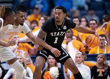 Mississippi State Bulldogs forward Tolu Smith (1) drives against Tennessee Volunteers forward Jonas Aidoo (0) during their SEC Men's Basketball Tournament quarterfinal game at Bridgestone Arena in Nashville, Tenn., Friday, March 15, 2024.