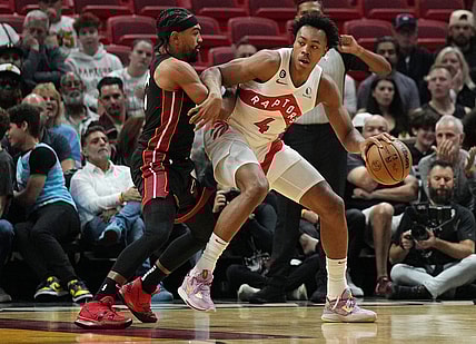 Oct 22, 2022; Miami, Florida, USA; Miami Heat guard Gabe Vincent (2) battles for position against Toronto Raptors forward Scottie Barnes (4) in the first half at FTX Arena. Mandatory Credit: Jim Rassol-USA TODAY Sports