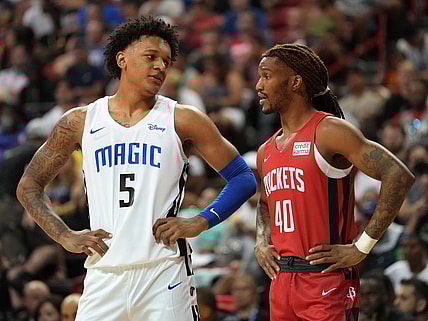 Jul 7, 2022; Las Vegas, NV, USA; Orlando Magic forward Paolo Banchero (5) talks to Houston Rockets forward Trhae Mitchell (40) during an NBA Summer League game at T&M. Mandatory Credit: Stephen R. Sylvanie-USA TODAY Sports