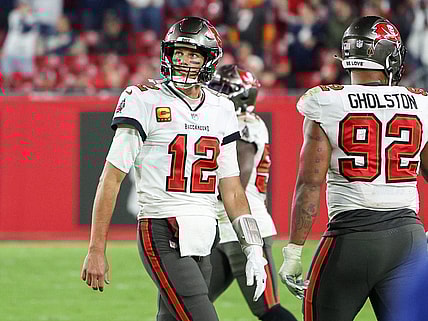 Jan 16, 2023; Tampa, Florida, USA; Tampa Bay Buccaneers quarterback Tom Brady (12) walks off the field in the final minute against the Dallas Cowboys in the fourth quarter during a wild card game at Raymond James Stadium. Mandatory Credit: Nathan Ray Seebeck-USA TODAY Sports